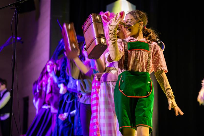 Students perform onstage